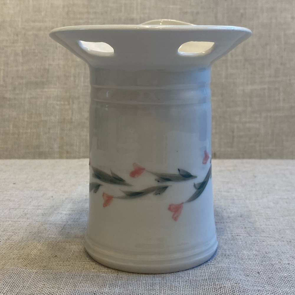 Signed handmade ceramic glazed vase. White with simple pink flower pattern.